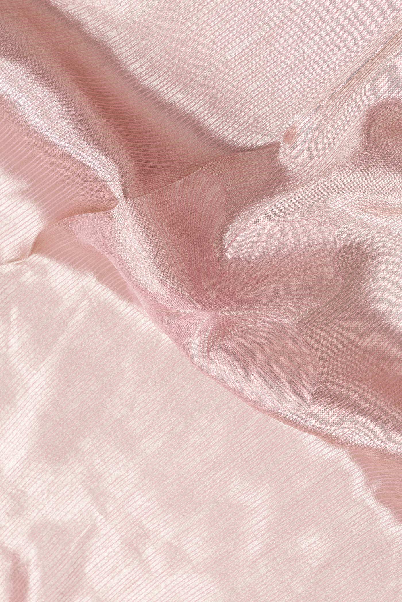 Close up of Pink Dual Tone Mysore Georgette Saree with Zari Brocade on the body and Embroidery Border.  displaying folds