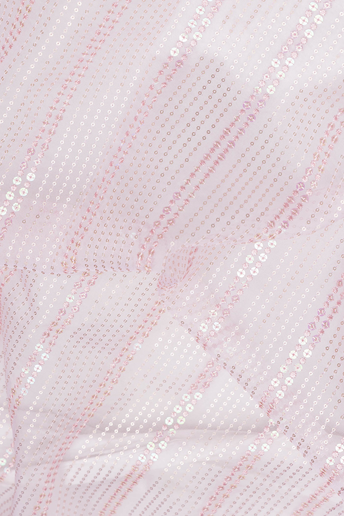 Close up of Pink Dual Tone Organza Silk Saree with Embroidery on the body and Embroidery Border.  displaying folds