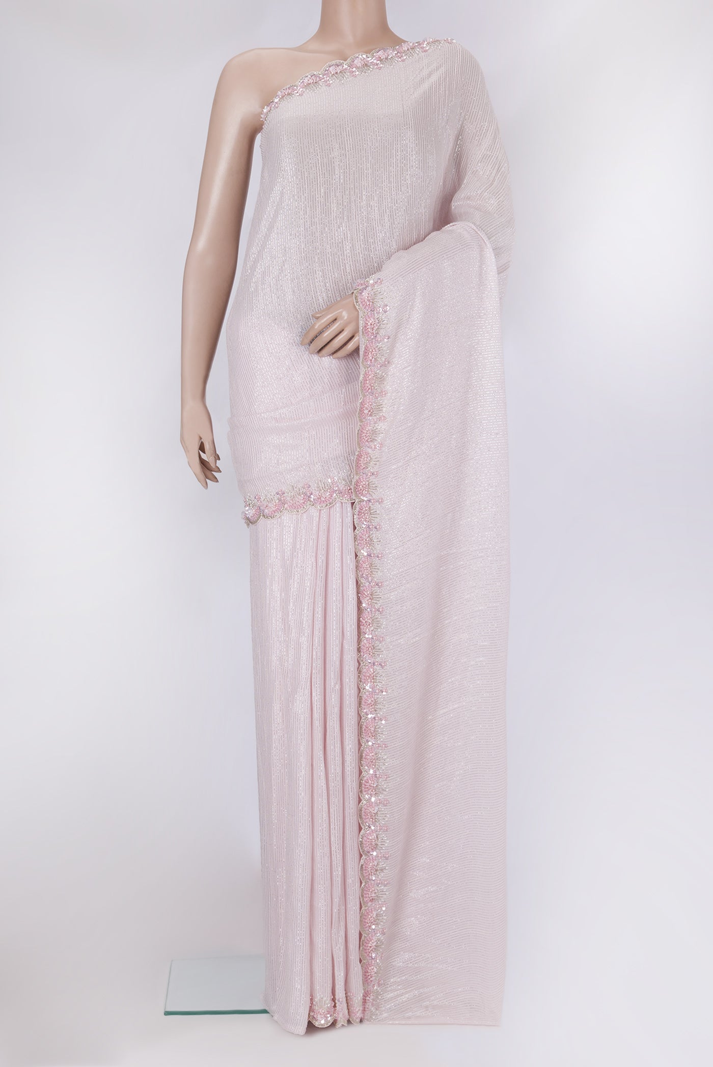 Rose Gold Dual Tone Georgette Saree with Embroidery on the body and Sequin Border.  displayed on a mannequin