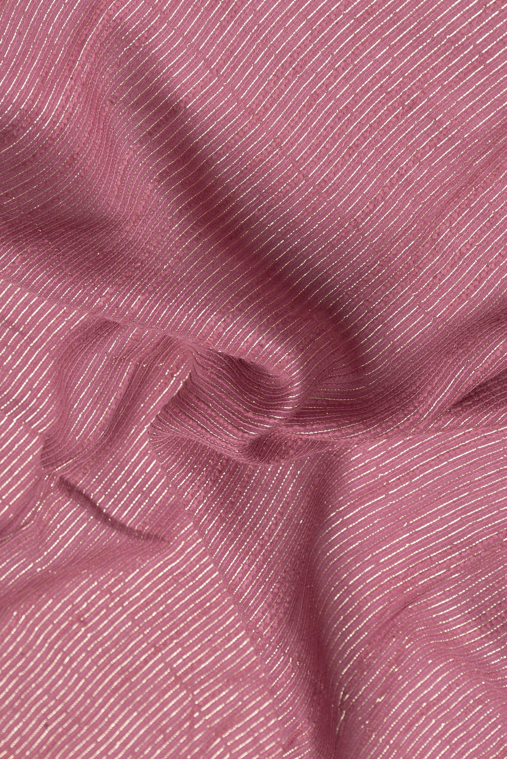 Close up of Pink Dual Tone Georgette Saree with Zari Brocade on the body and Embroidery Border.  displaying folds