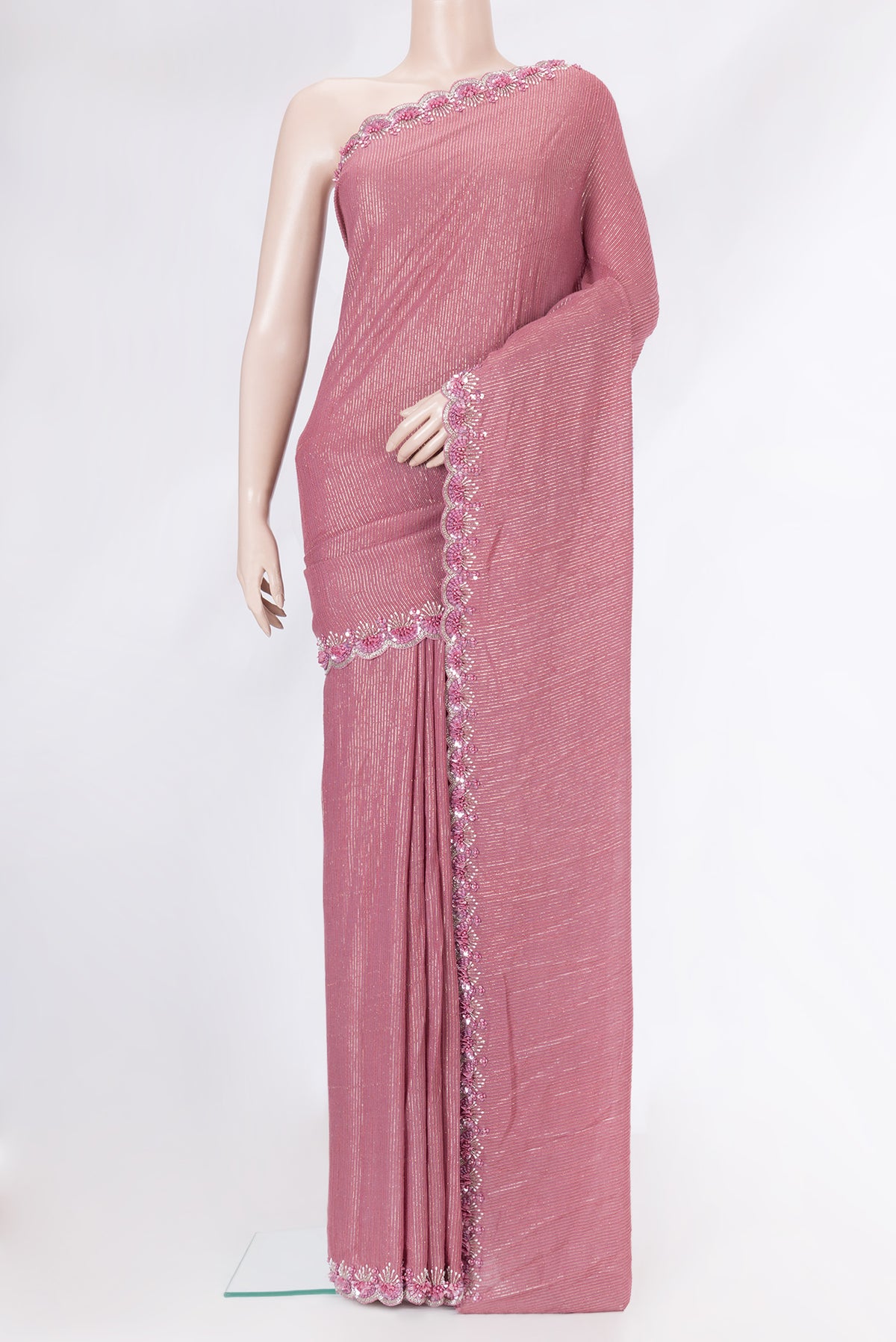 Pink Dual Tone Georgette Saree with Zari Brocade on the body and Embroidery Border.  displayed on a mannequin