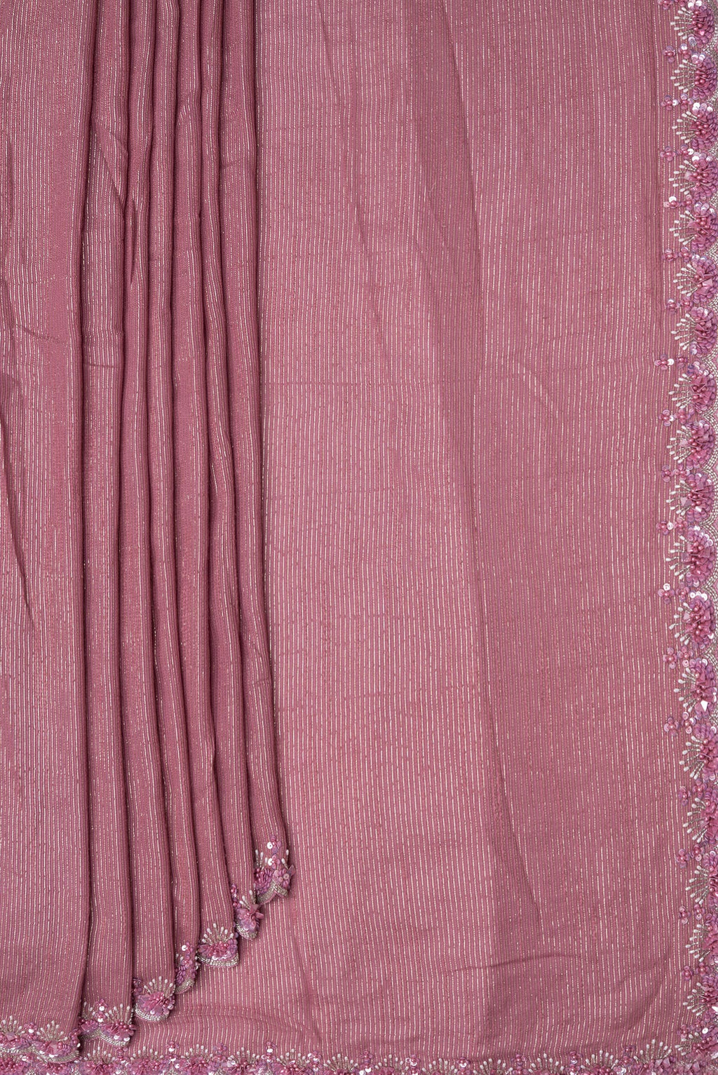 Pleats and pallu of Pink Dual Tone Georgette Saree with Zari Brocade on the body and Embroidery Border. 