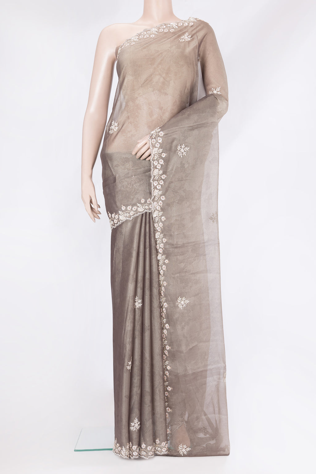 Grey Georgette Saree with Embroidery on the body and Embroidery Border.  displayed on a mannequin
