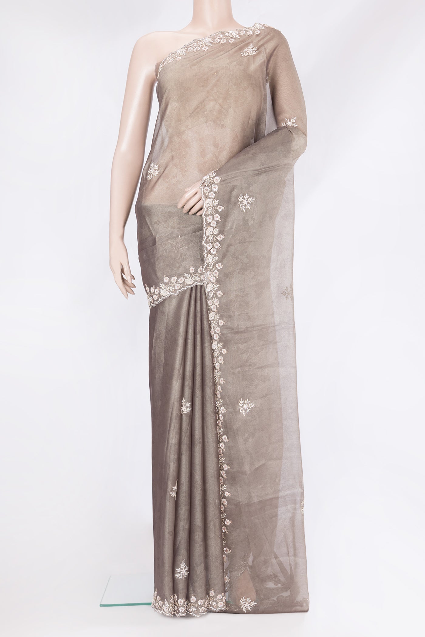 Grey Georgette Saree with Embroidery on the body and Embroidery Border.  displayed on a mannequin