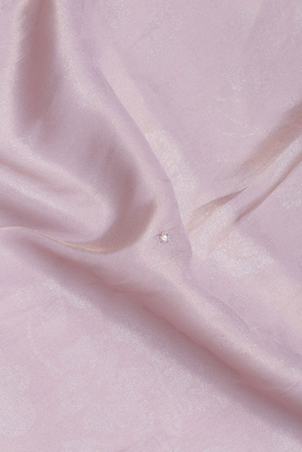 Close up of Lilac Crepe Saree with Embroidery on the body and Embroidery Border.  displaying folds