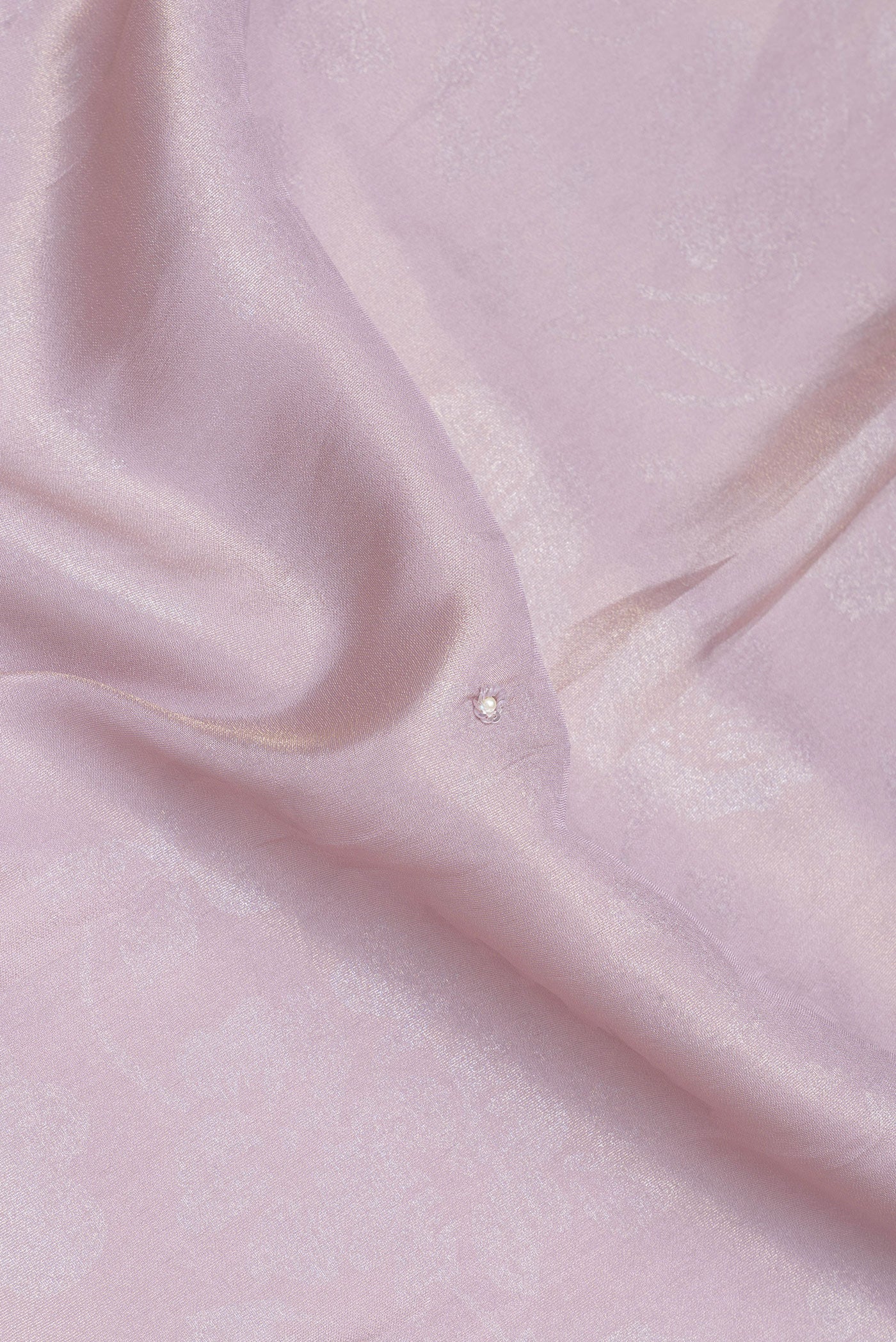 Close up of Lilac Crepe Saree with Embroidery on the body and Embroidery Border.  displaying folds