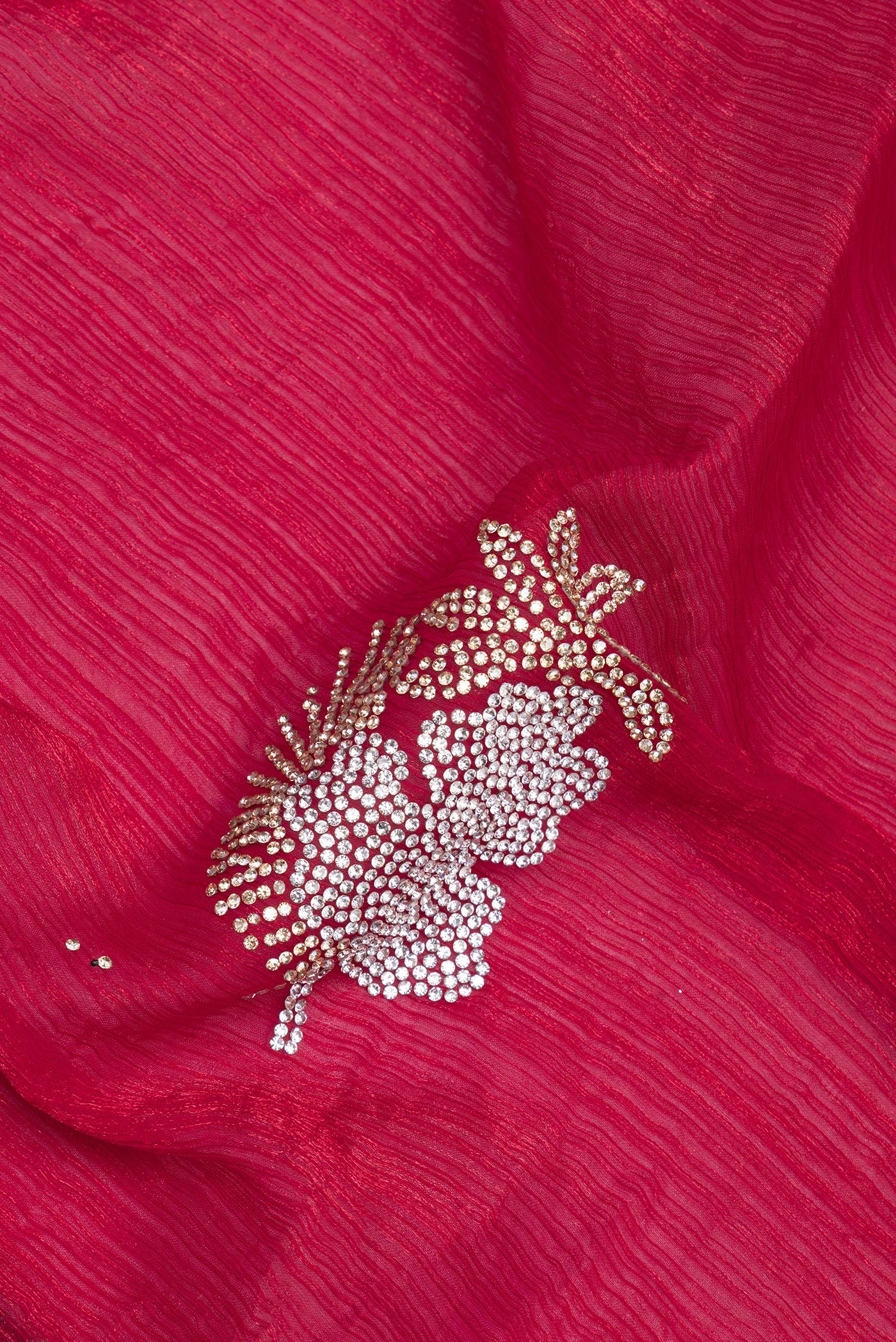 Close up of Maroon Dual Tone Blended Satin Crepe Saree with Embroidery on the body and Embroidery Border.  displaying folds