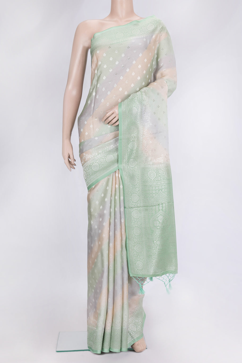 Green and Grey Color Organza Silk Saree with Zari Butta on the body and Zari Border.  displayed on a mannequin