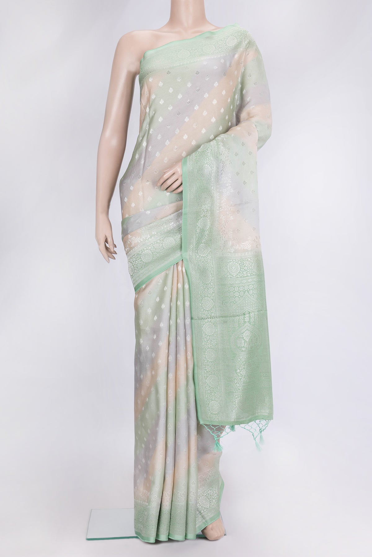 Green and Grey Color Organza Silk Saree with Zari Butta on the body and Zari Border.  displayed on a mannequin