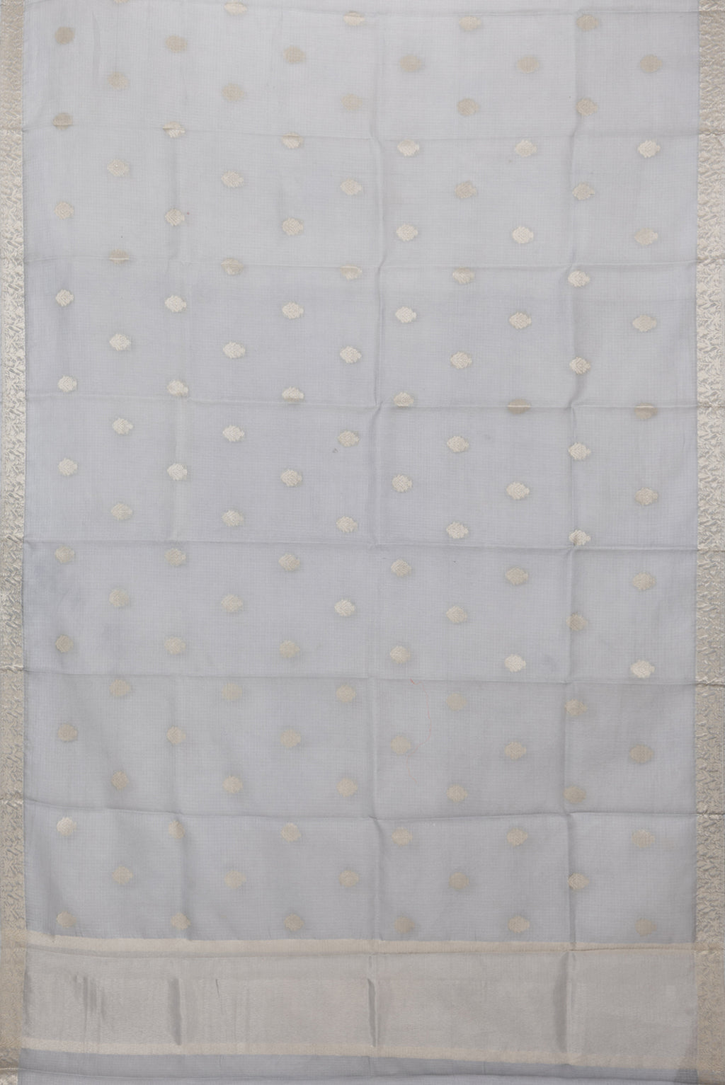 Flat view of Grey Kota Silk Saree with Zari Butta on the body and Zari Border. 