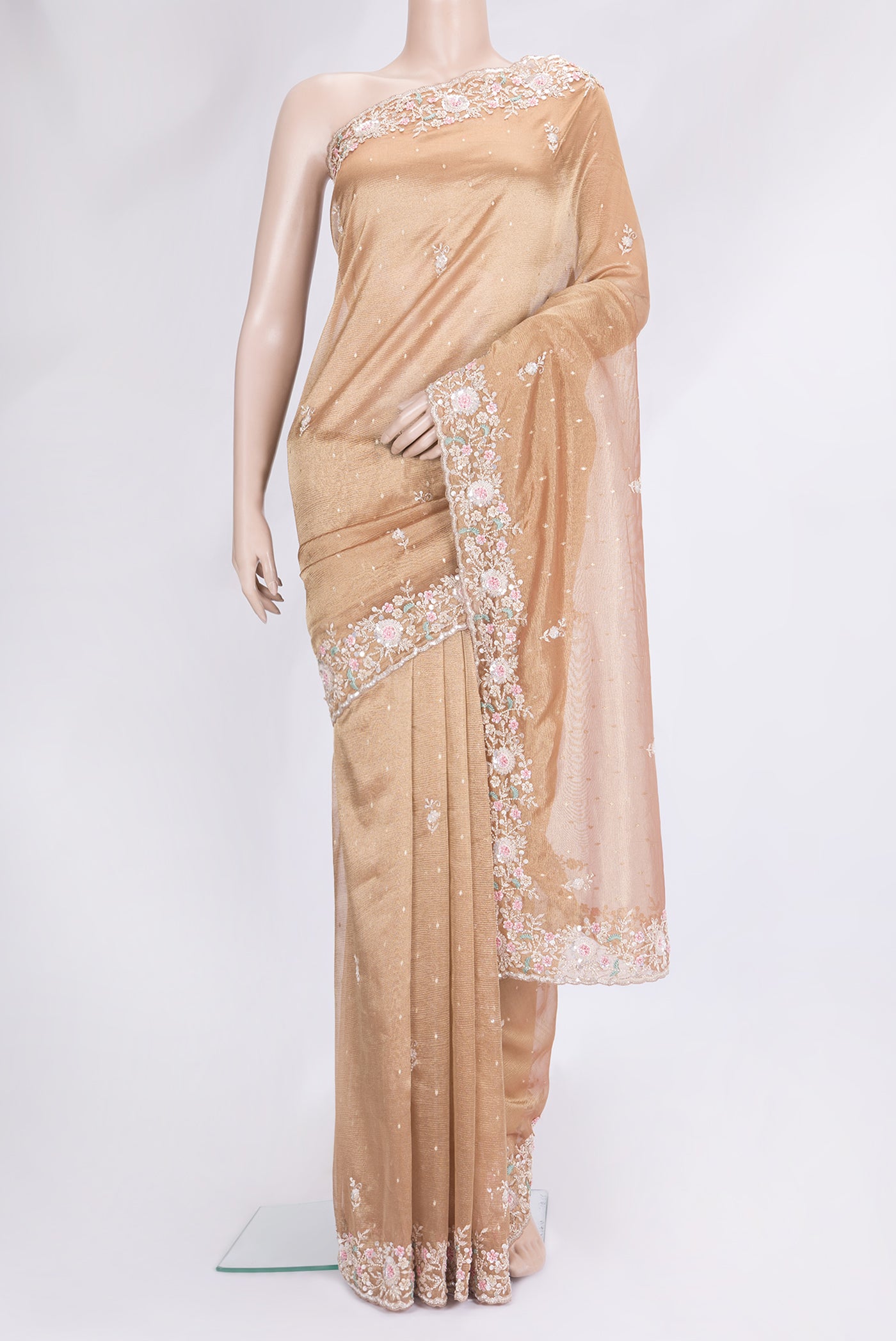 Rose Gold Dual Tone Organza Silk Saree with Embroidery on the body and Embroidery Border.  displayed on a mannequin
