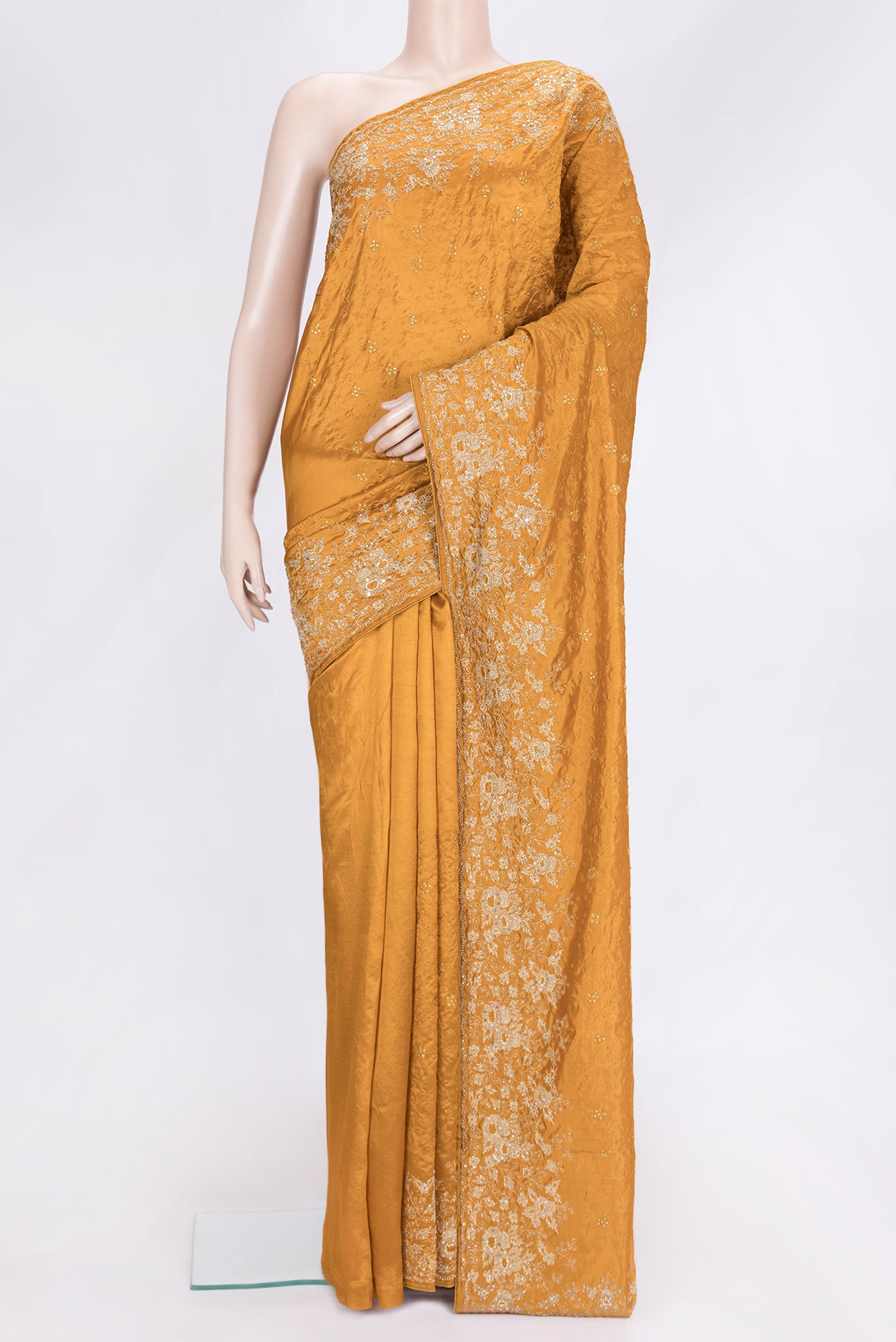 Mustard Dual Tone Tussar Silk Saree with Embroidery on the body and Embroidery Border.  displayed on a mannequin