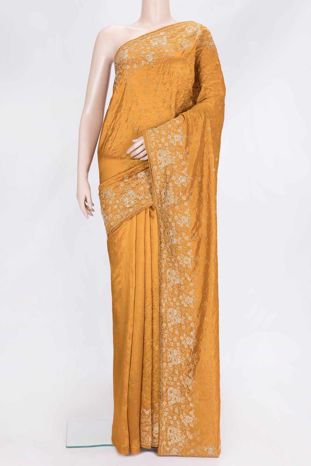 Mustard Dual Tone Tussar Silk Saree with Embroidery on the body and Embroidery Border.  displayed on a mannequin