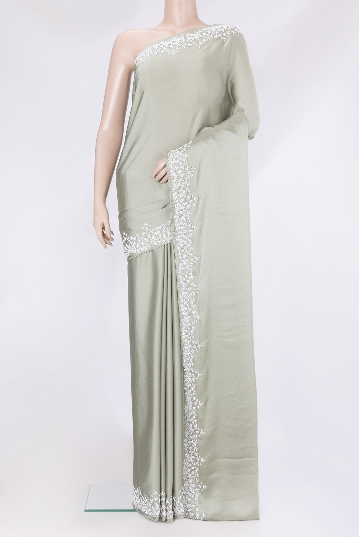 Sage Green Blended Satin Crepe Saree with Plain Body and Sequin Border.  displayed on a mannequin