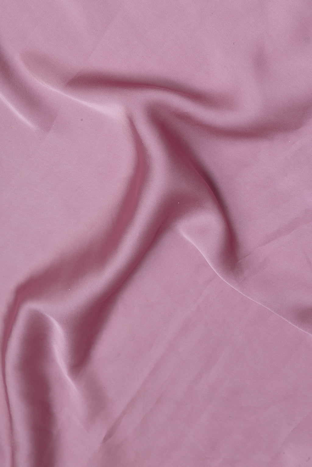 Close up of Lilac Crepe Saree with Plain Body and Embroidery Border.  displaying folds