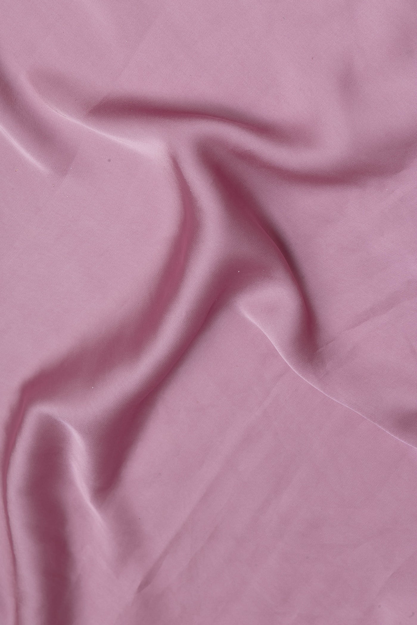 Close up of Lilac Crepe Saree with Plain Body and Embroidery Border.  displaying folds