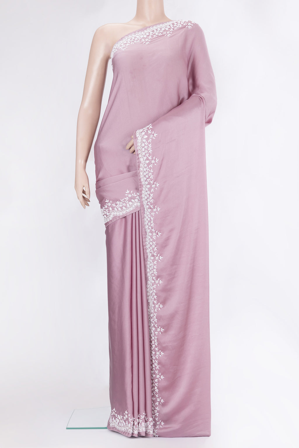 Lilac Crepe Saree with Plain Body and Embroidery Border.  displayed on a mannequin