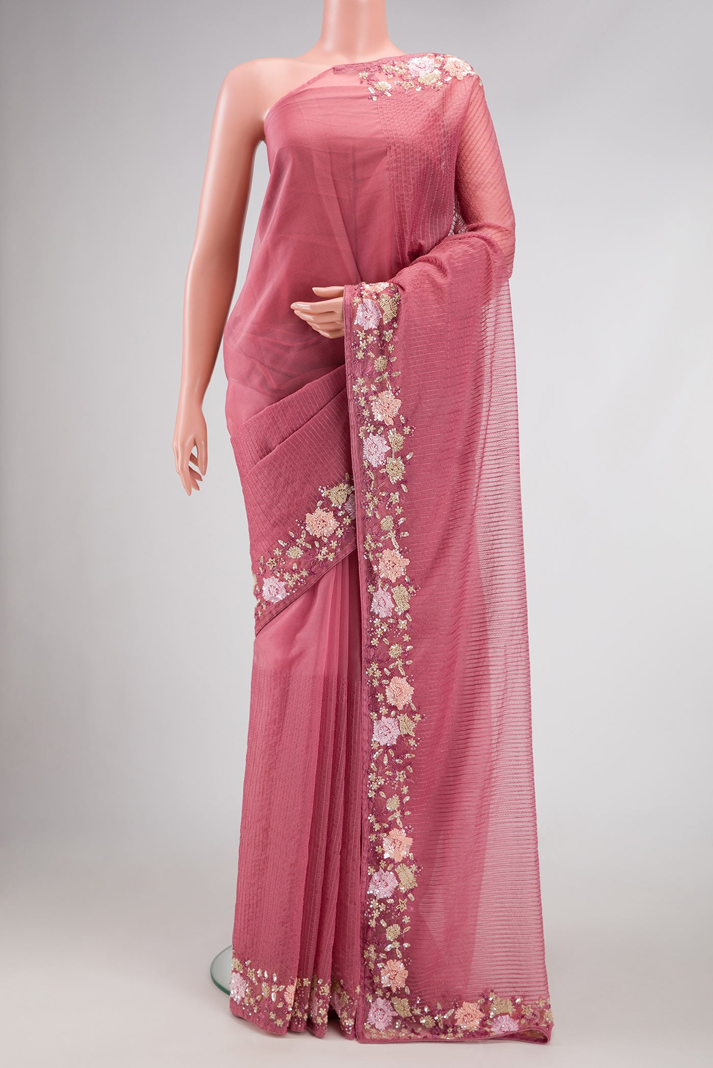Pink Dual Tone Organza Silk Saree with Embroidery on the body and Embroidery Border.  displayed on a mannequin