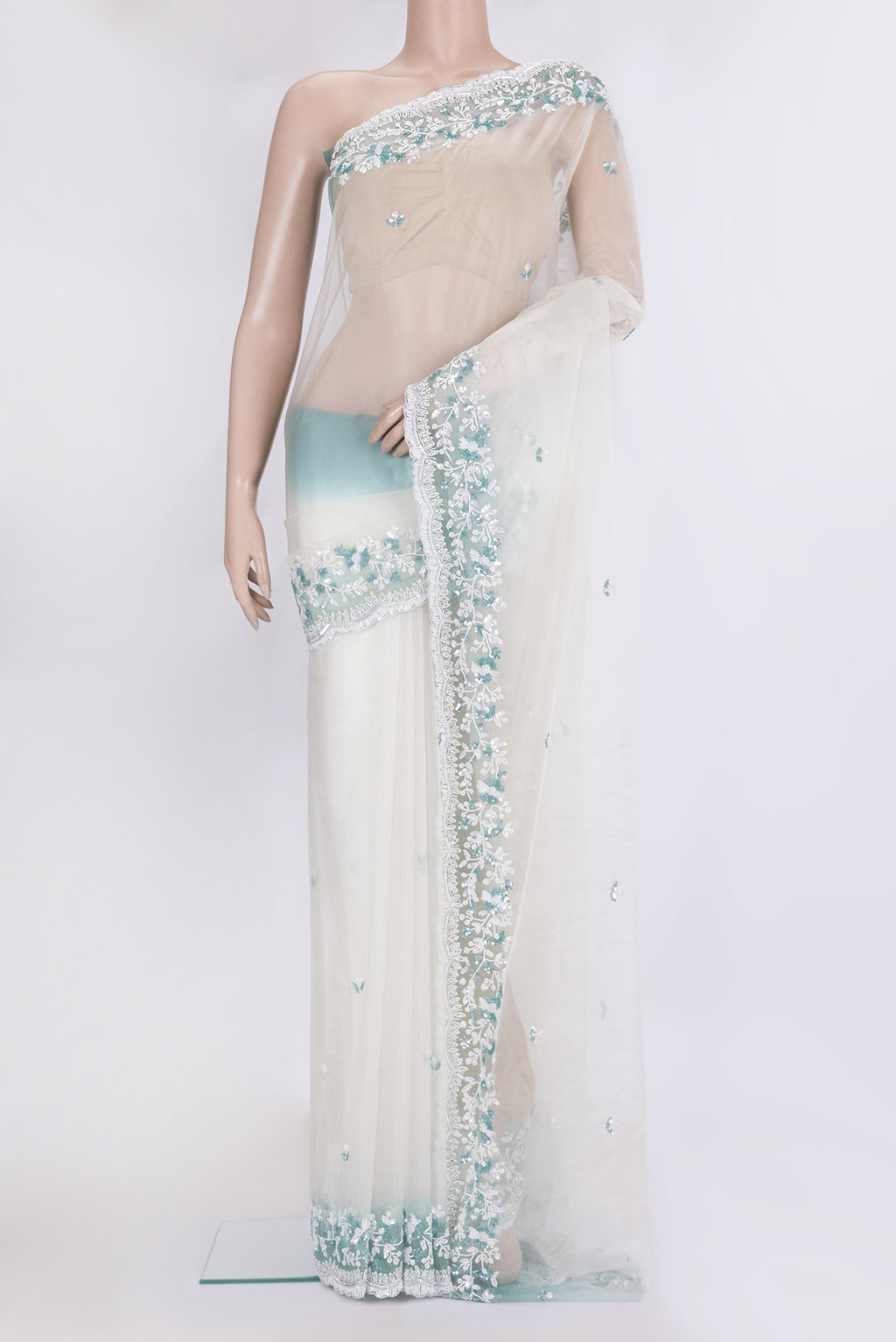 Off White Dual Tone Organza Silk Saree with Embroidery on the body and Embroidery Border.  displayed on a mannequin