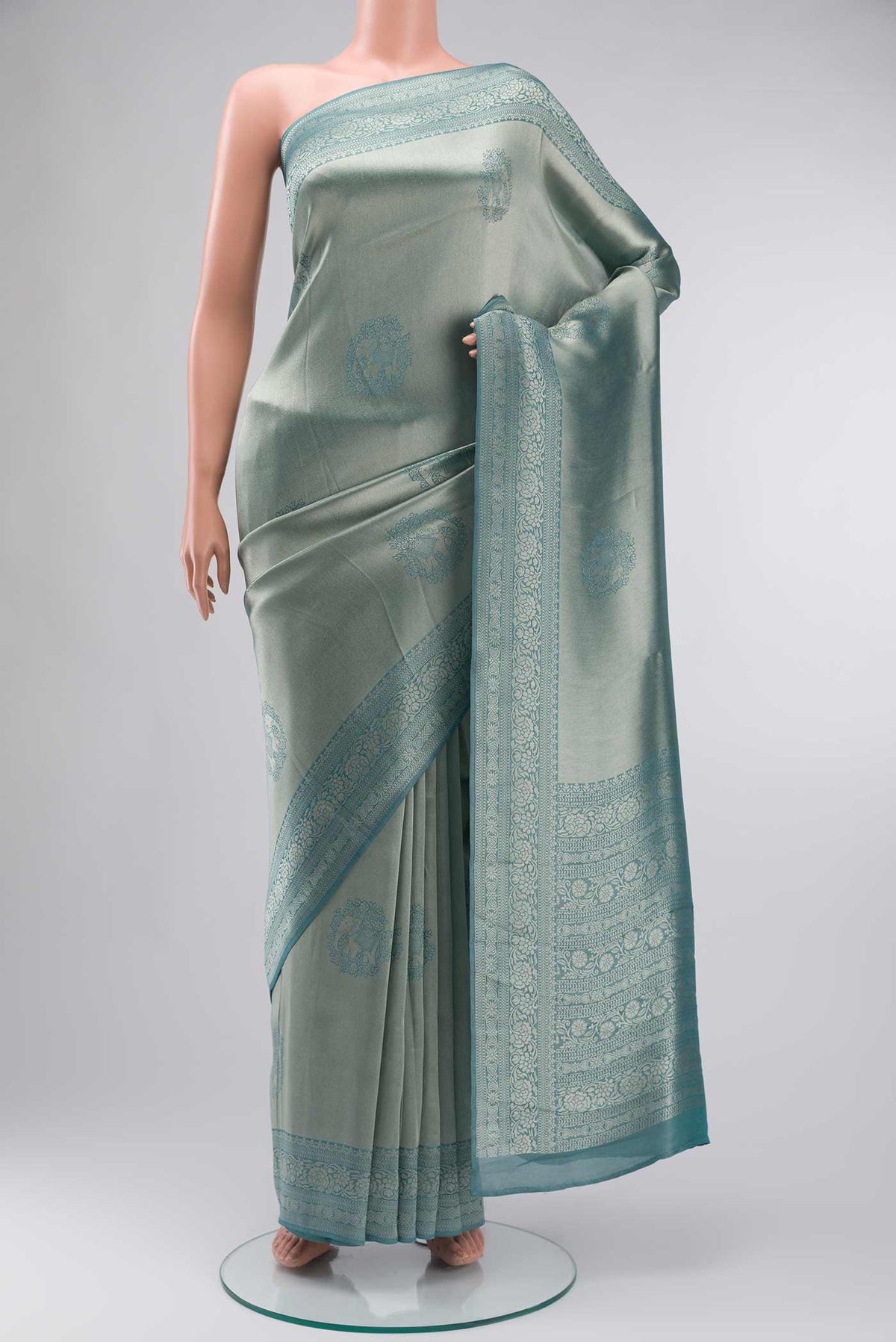 Blue Blended Art Silk Saree with Zari Butta on the body and Zari Border displayed on a mannequin