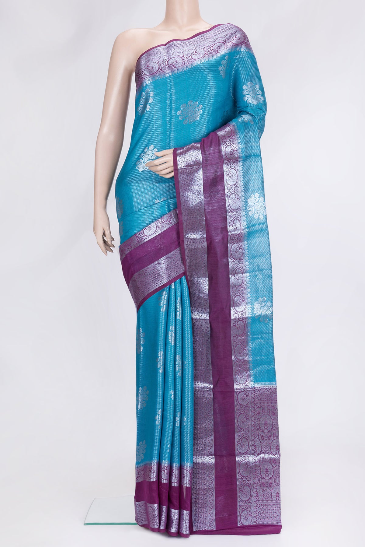 Sky Blue Dual Tone Tussar Silk Saree with Zari Brocade on the body and Zari Border.  displayed on a mannequin