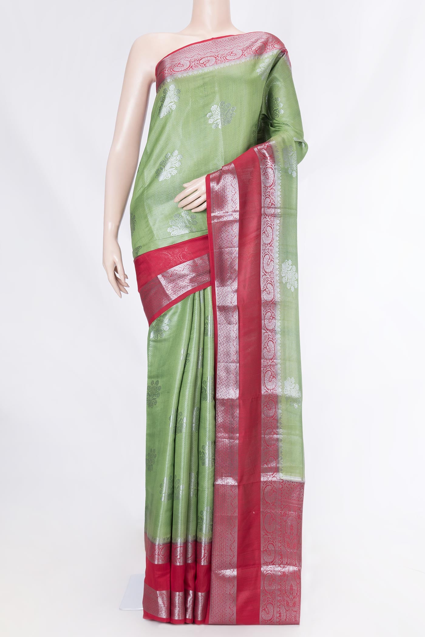 Green Dual Tone Tussar Saree with Zari Brocade on the body and Zari Border displayed on a mannequin