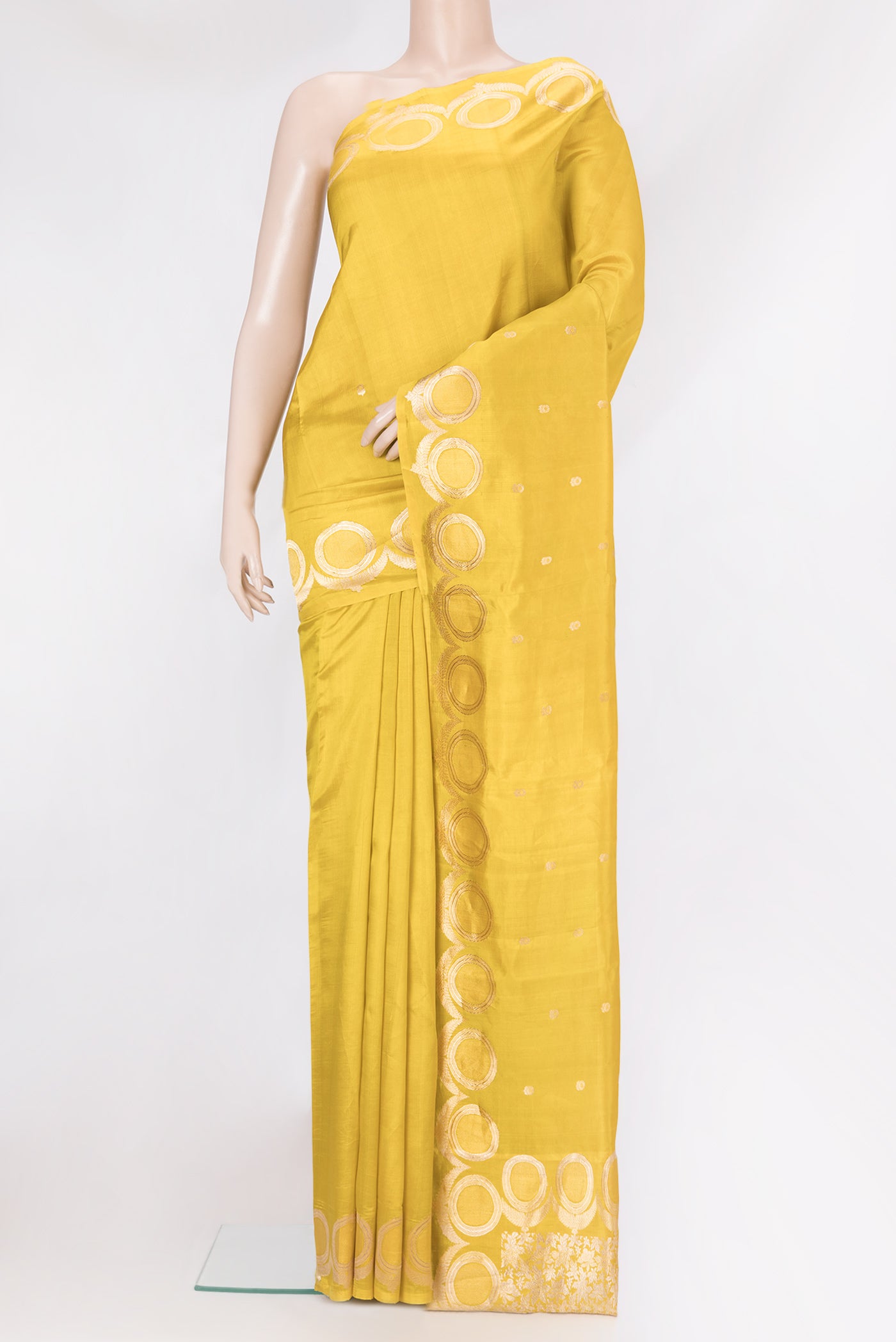 Yellow Dual Tone Tussar Silk Saree with Zari Butta on the body and Fancy Border.  displayed on a mannequin