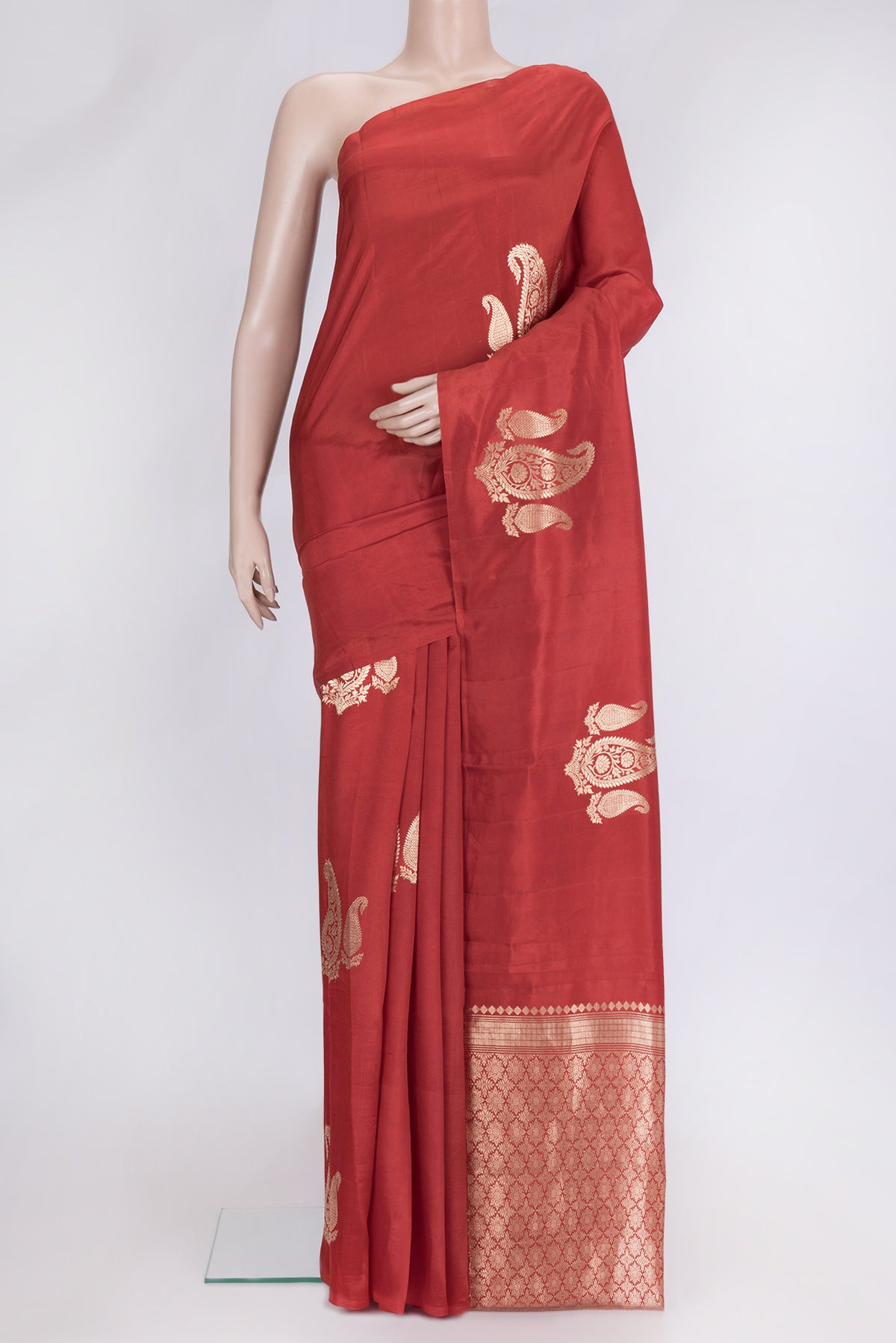 Red Dual Tone Tussar Silk Saree with Zari Butta on the body and Without Border.  displayed on a mannequin