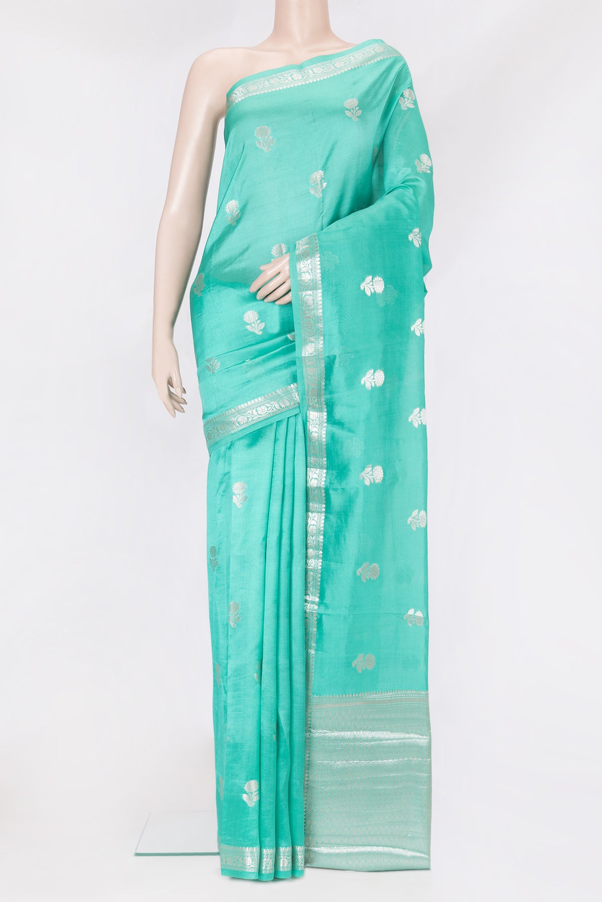 Sea Green Dual Tone Tussar Silk Saree with Zari Butta on the body and Zari Border.  displayed on a mannequin