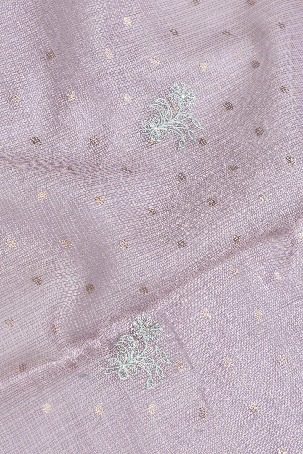 Close up of Lavender Dual Tone Kota Silk Saree with Embroidery on the body and Without Border.  displaying folds