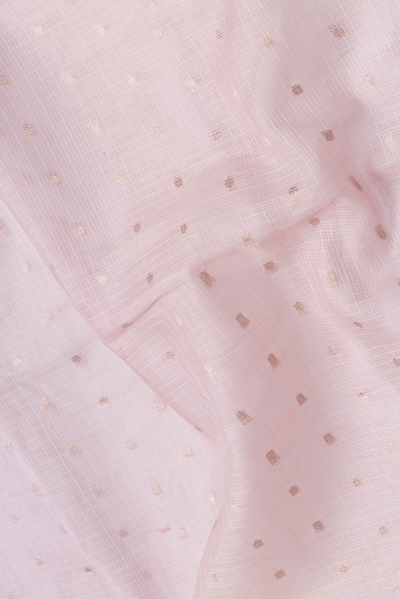 Close up of Rose Gold Dual Tone Kota Silk Saree with Zari Butta on the body and Without Border.  displaying folds