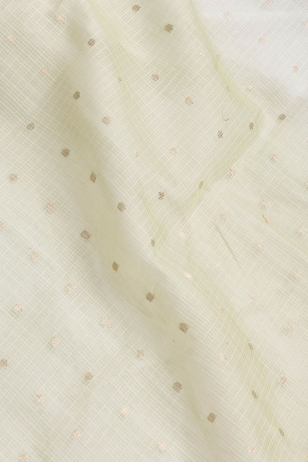 Close up of Pista Green Dual Tone Kota Silk Saree with Zari Butta on the body and Without Border.  displaying folds