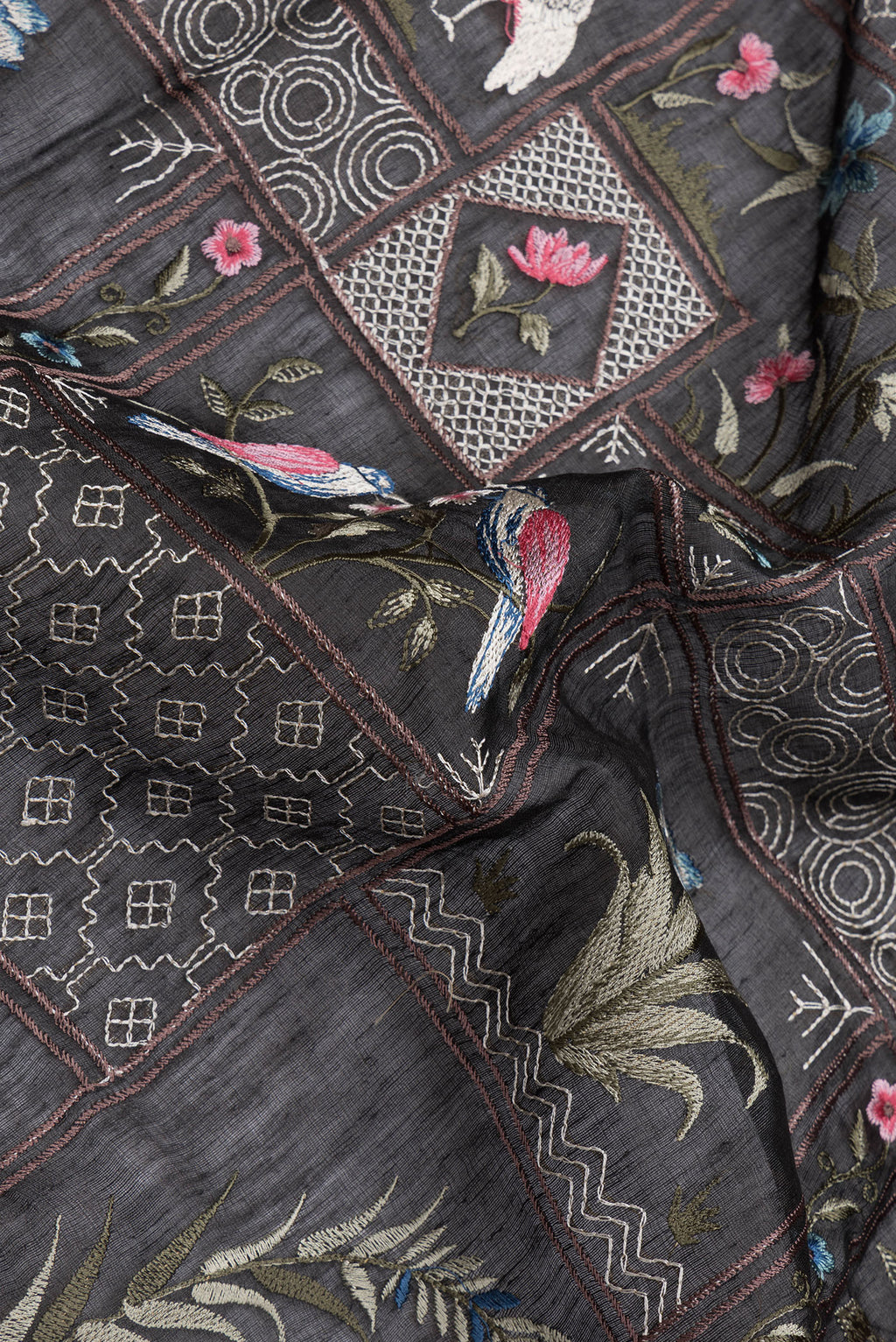 Close up of Black Dual Tone Linen Saree with Embroidery on the body and Zari Border.  displaying folds