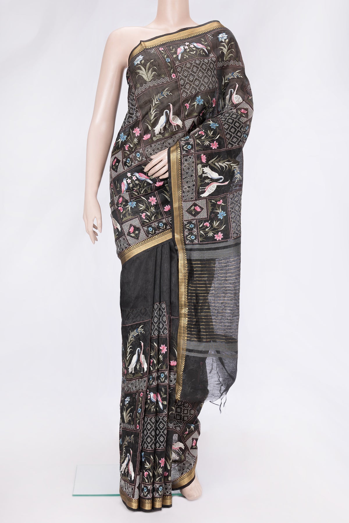 Black Dual Tone Linen Saree with Embroidery on the body and Zari Border.  displayed on a mannequin