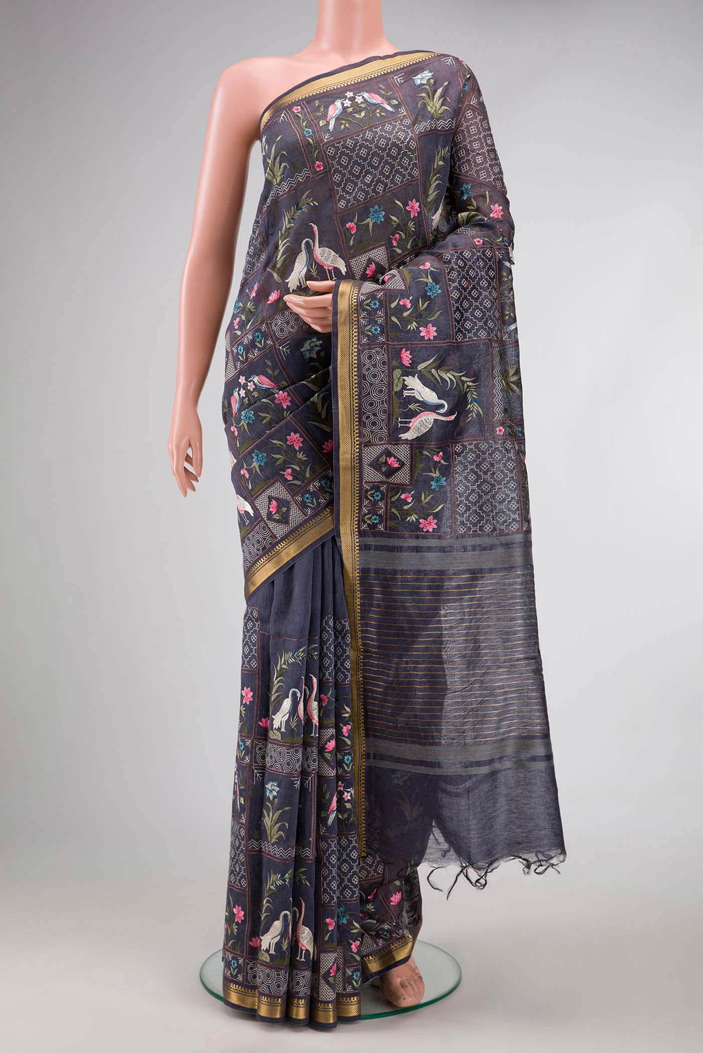 Blue Grey Dual Tone Tussar Silk Saree with Embroidery on the body and Embroidery Border.  displayed on a mannequin