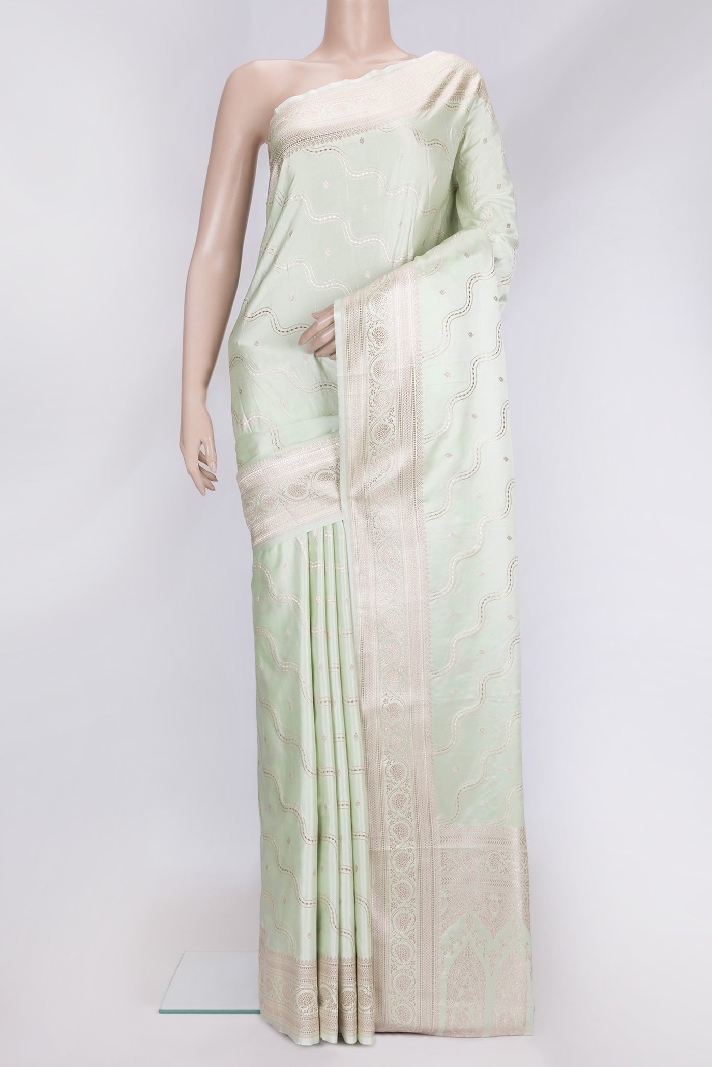 Pista Green Dual Tone Blended Banarasi Silk Saree with Zari Brocade on the body and Zari Border.  displayed on a mannequin