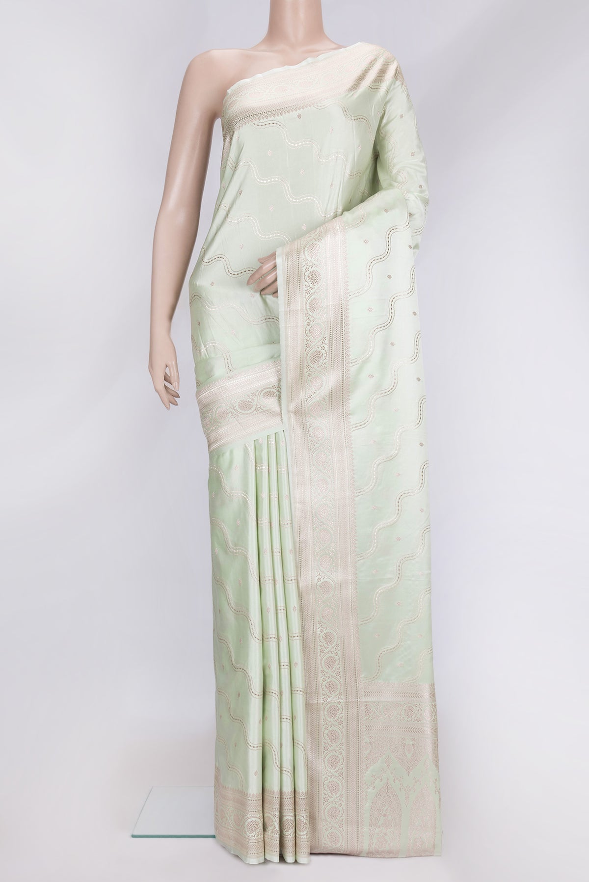 Pista Green Dual Tone Blended Banarasi Silk Saree with Zari Brocade on the body and Zari Border.  displayed on a mannequin