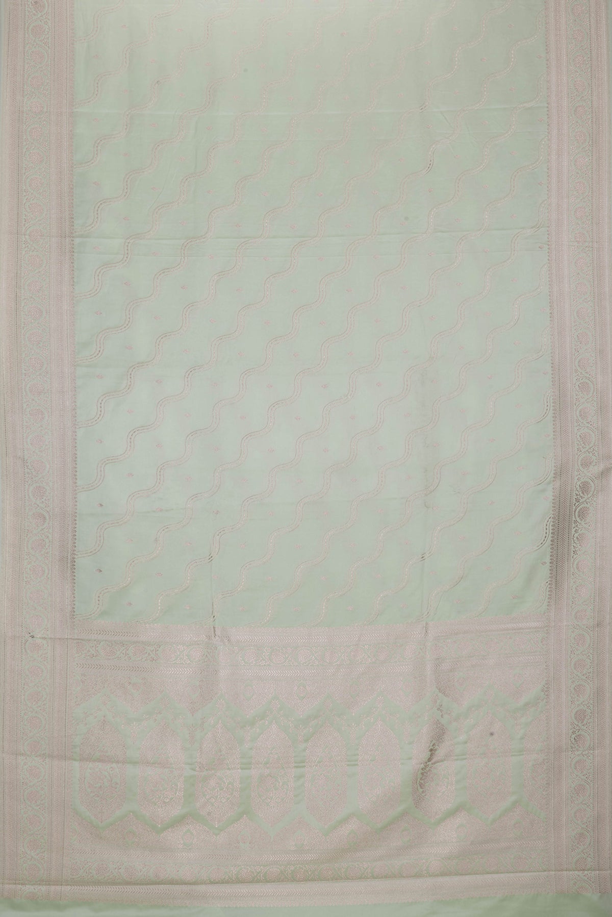 Flat view of Pista Green Dual Tone Blended Banarasi Silk Saree with Zari Brocade on the body and Zari Border. 