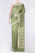 Green Dual Tone Raw Silk Saree with Zari Brocade on the body and Zari Border displayed on a mannequin