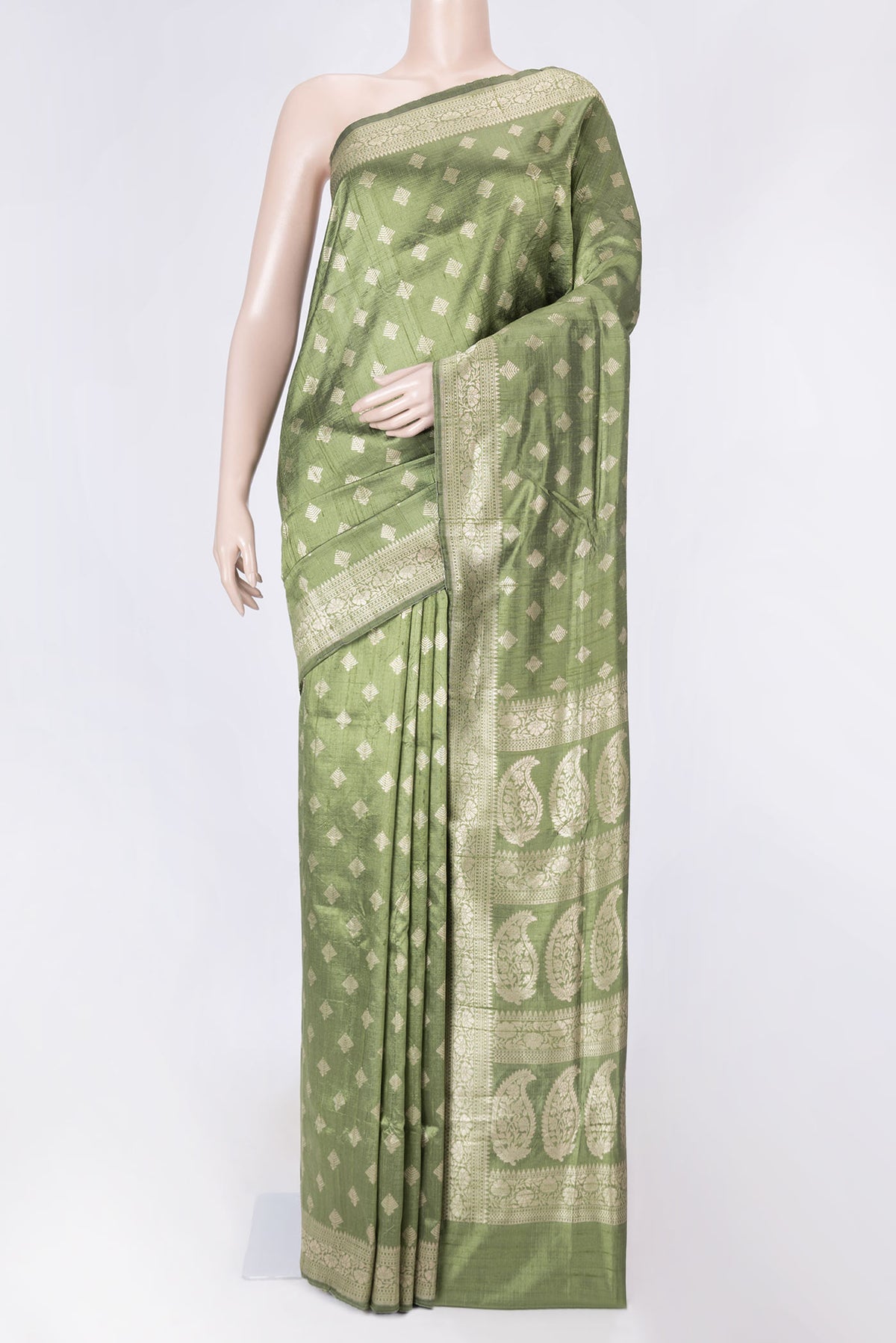 Green Dual Tone Raw Silk Saree with Zari Brocade on the body and Zari Border displayed on a mannequin