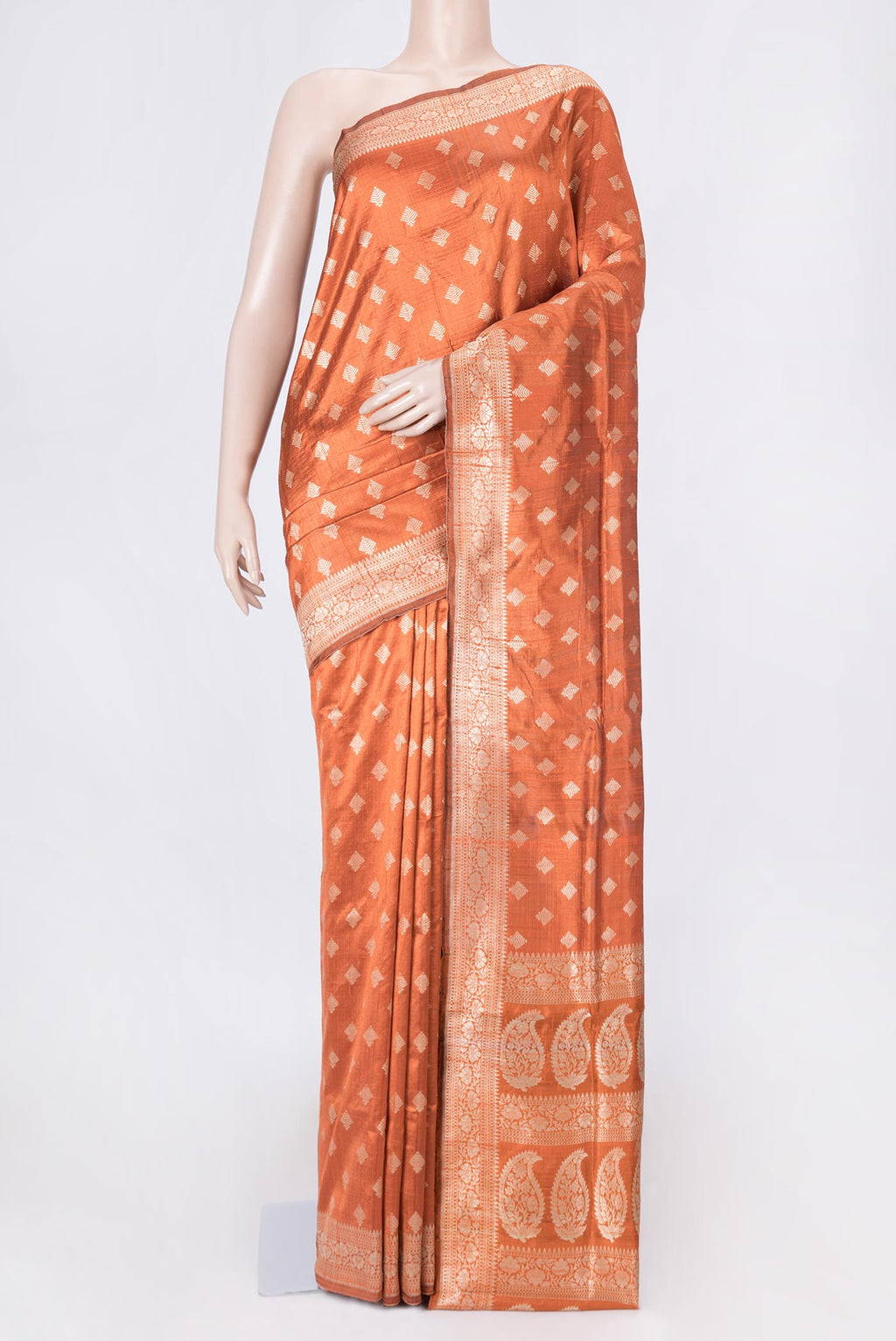 Brick Orange Dual Tone Raw Silk Saree with Zari Brocade on the body and Zari Border displayed on a mannequin