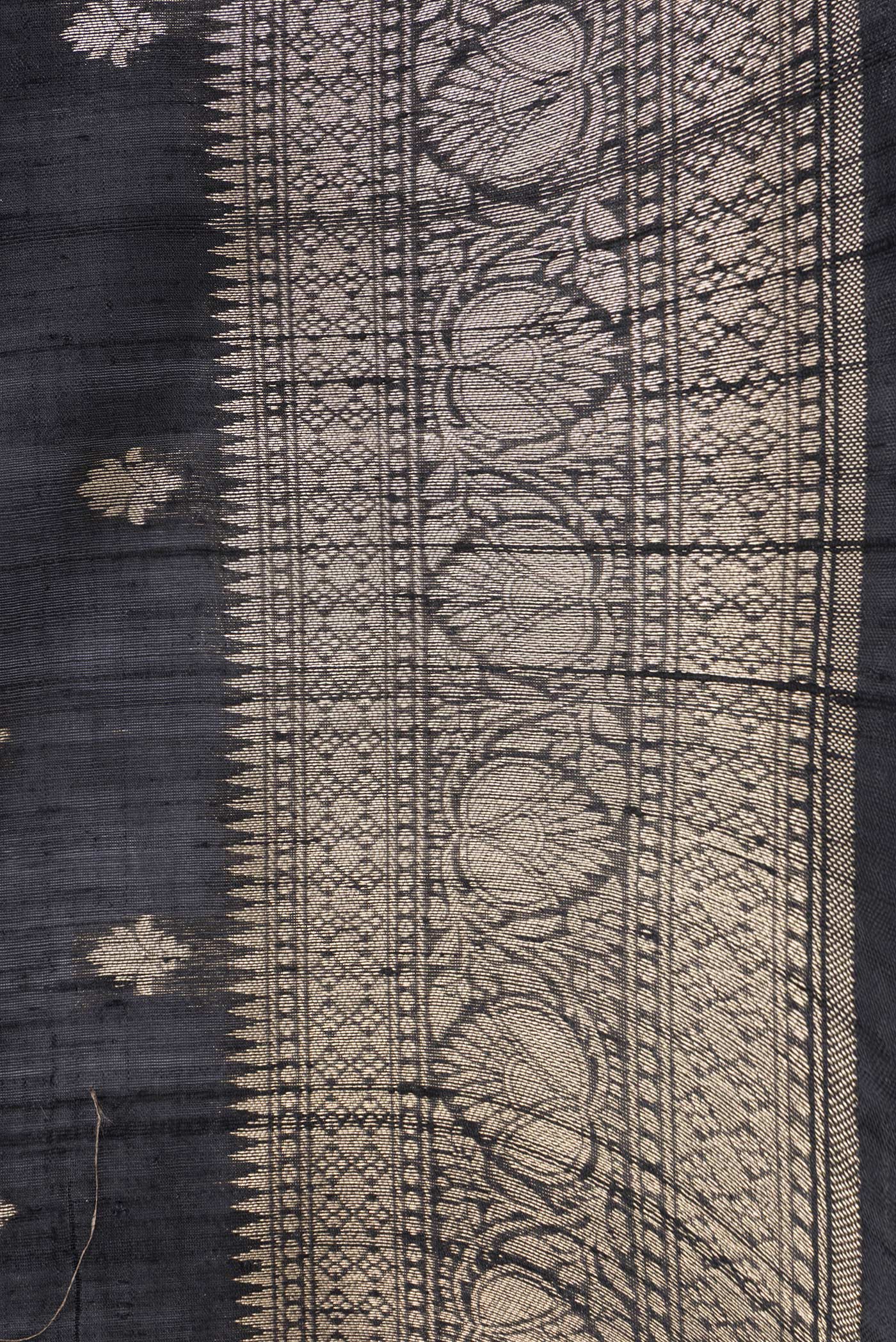 Border image of Black Dual Tone Raw Silk Saree with Zari Butta on the body and Zari Border. 
