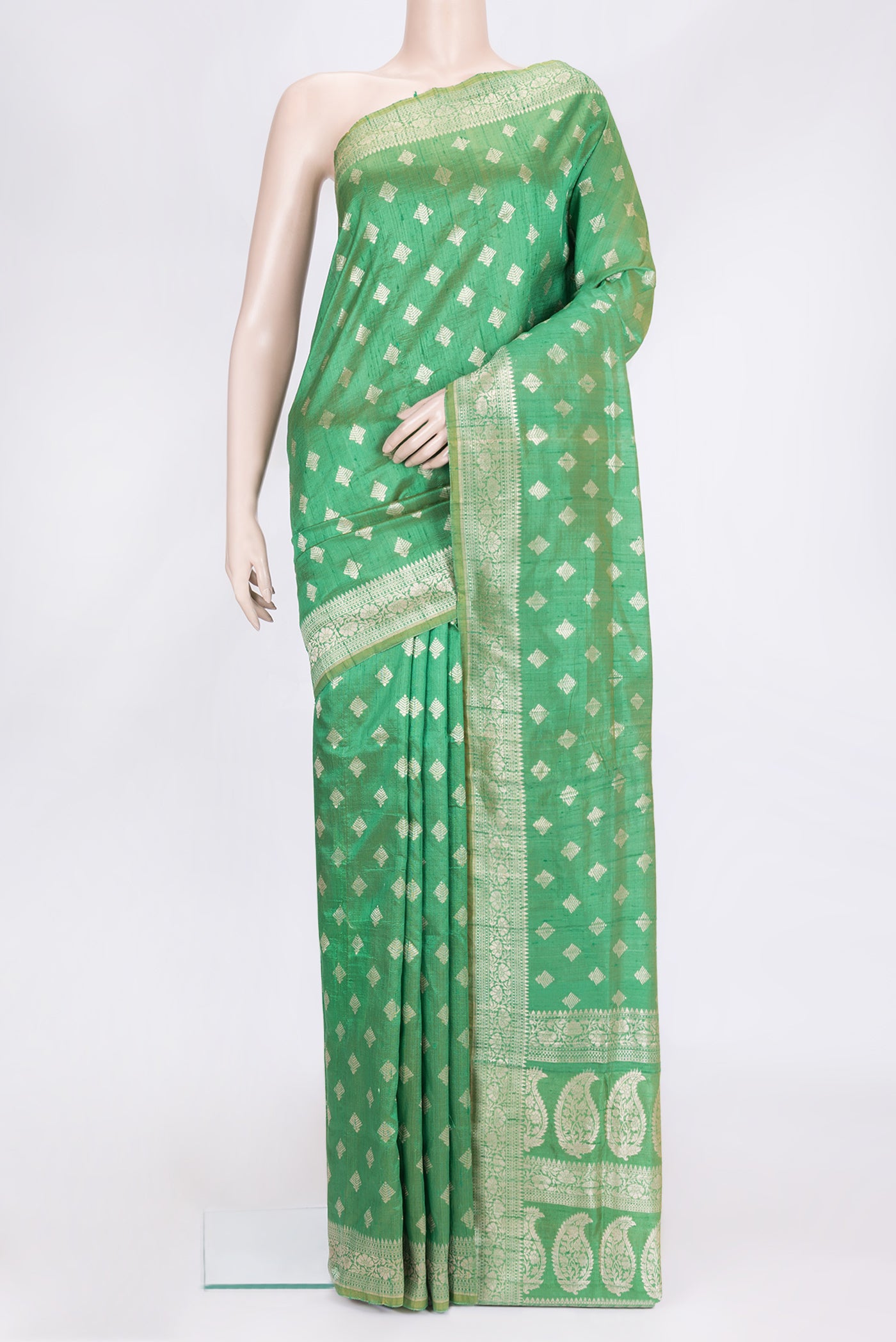 Green Dual Tone Raw Silk Saree with Zari Butta on the body and Zari Border.  displayed on a mannequin