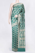 Green Dual Tone Raw Silk Saree with Zari Brocade on the body and Zari Border displayed on a mannequin