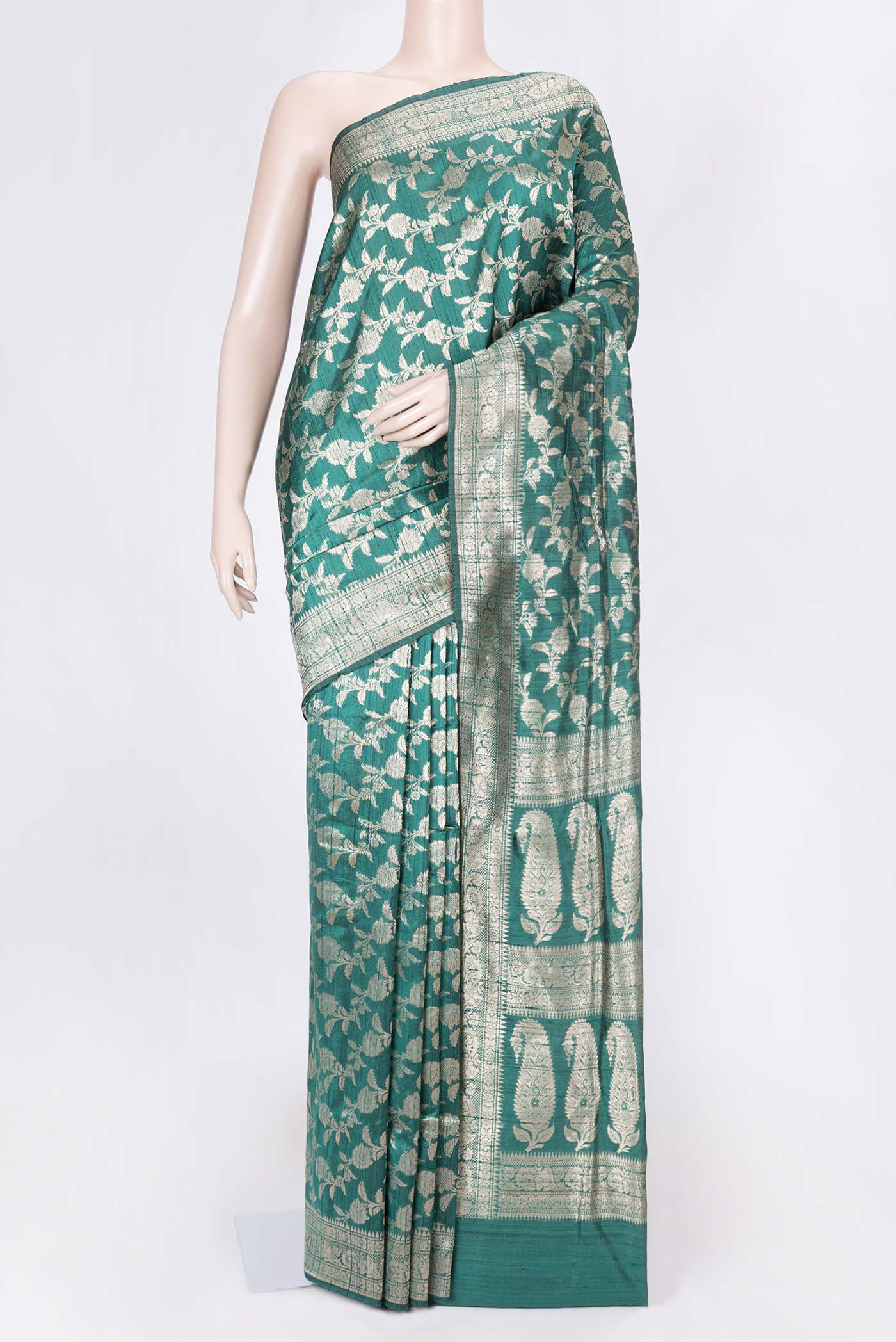 Green Dual Tone Raw Silk Saree with Zari Brocade on the body and Zari Border displayed on a mannequin