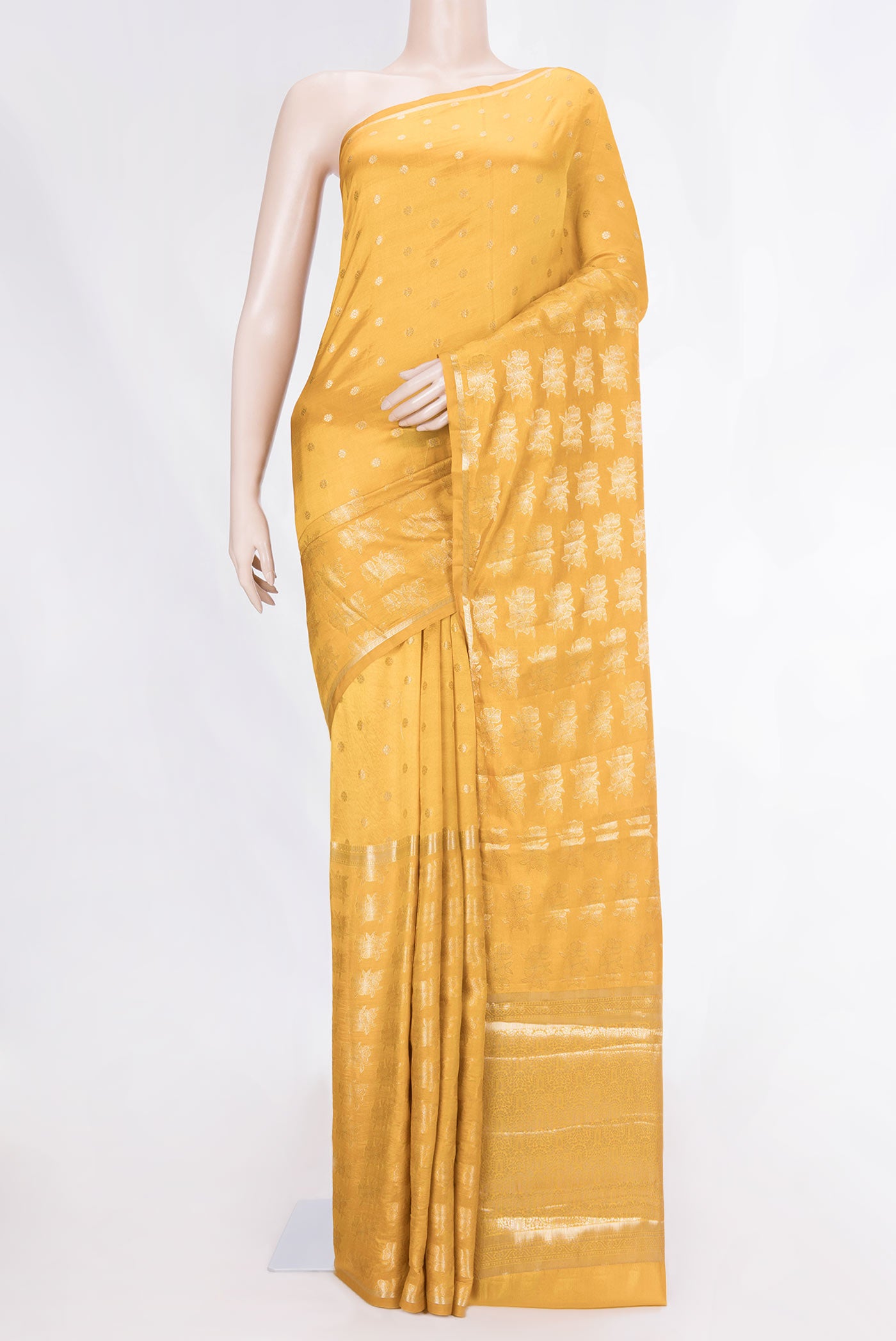 Yellow Banarasi Raw Silk Saree with Zari Butta on the body and Zari Border displayed on a mannequin