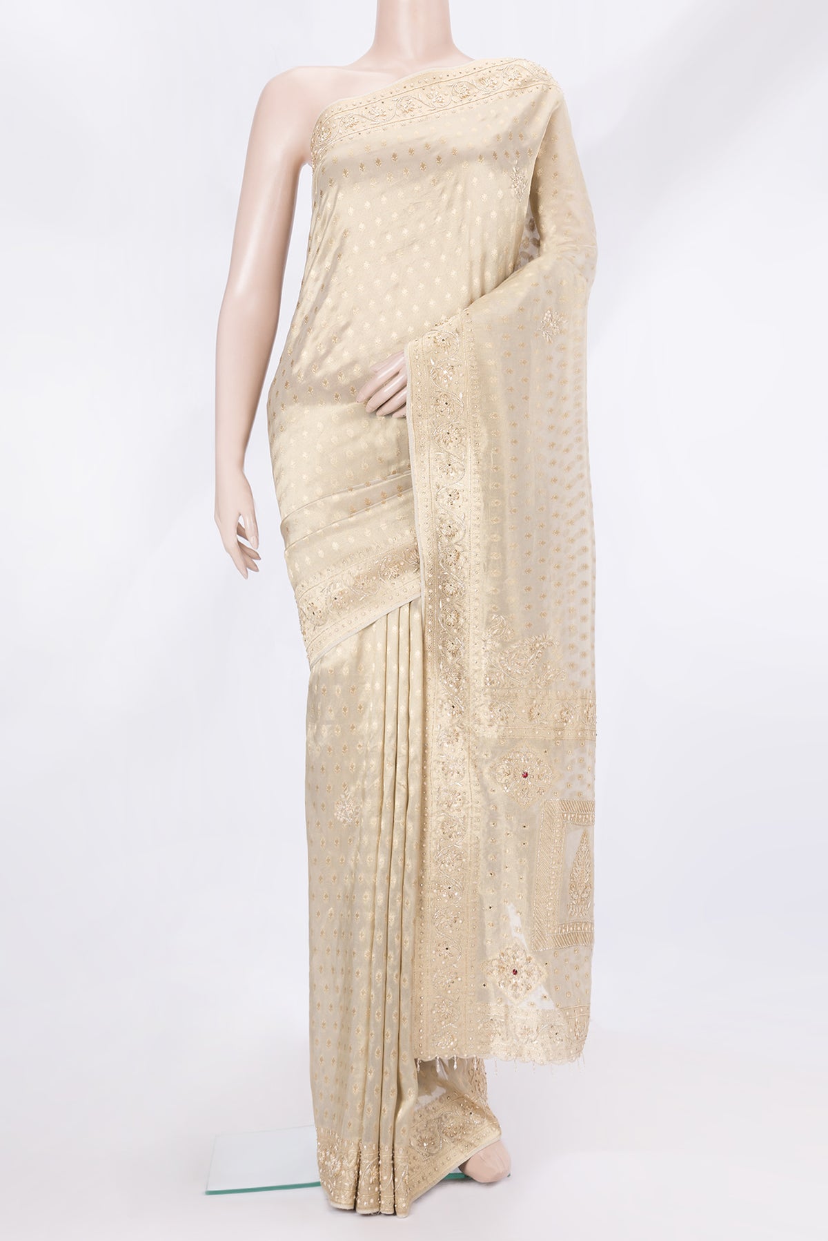 Gold Dual Tone Banarasi Georgette Saree with Zari Brocade on the body and Embroidery Border.  displayed on a mannequin