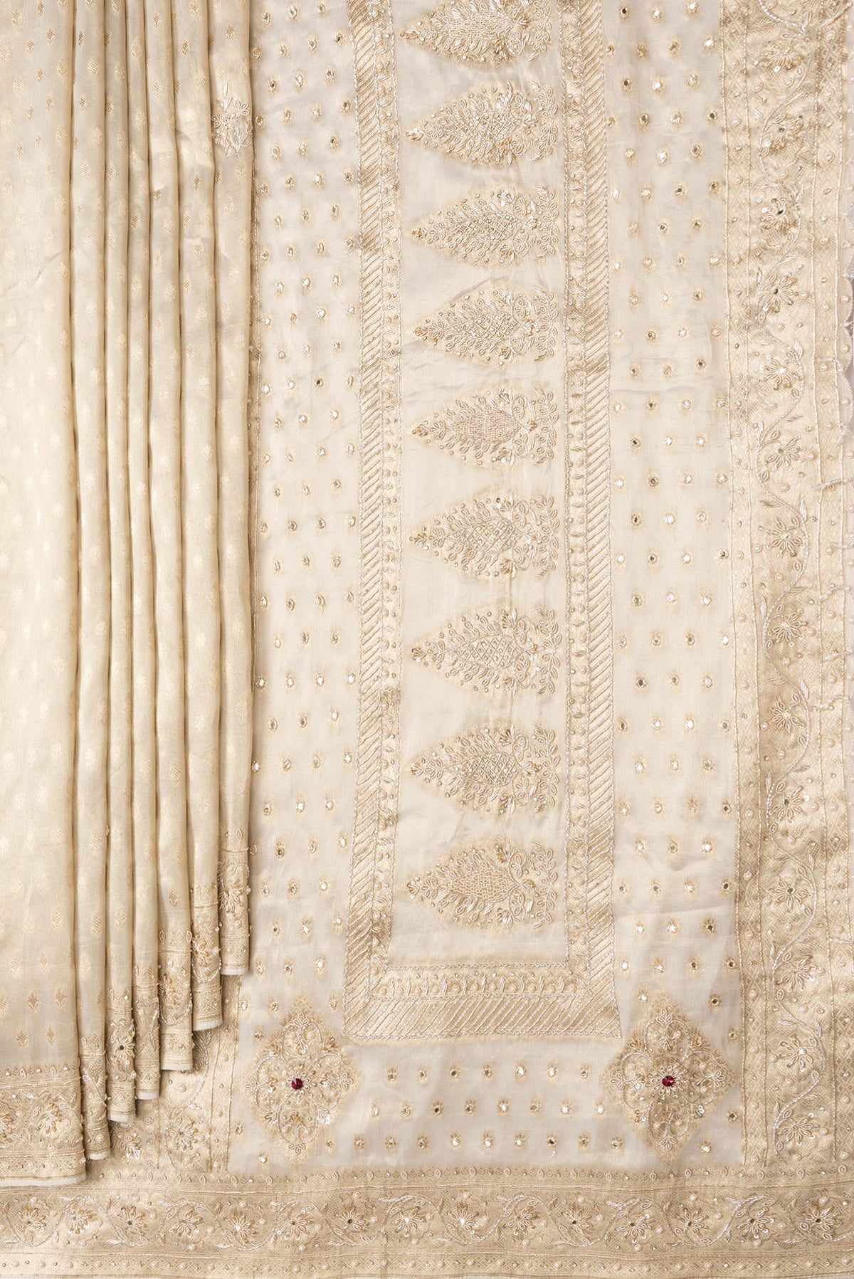 Pleats and pallu of Gold Dual Tone Banarasi Georgette Saree with Zari Brocade on the body and Embroidery Border. 