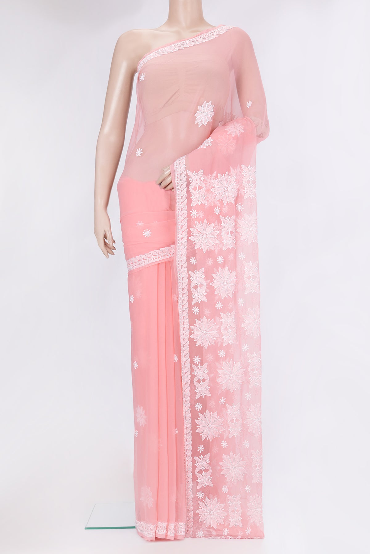 Rose pink Georgette Saree with Embroidery on the body and Embroidery Border.  displayed on a mannequin