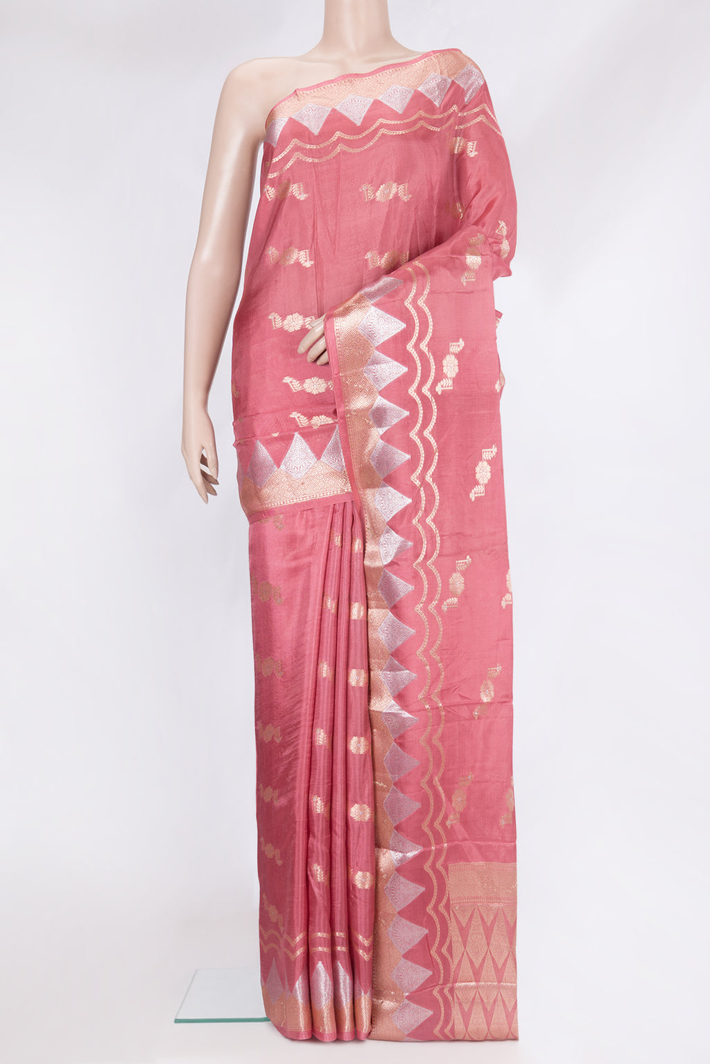 Coral Tussar Silk Saree with Zari Butta on the body and Fancy Border.  displayed on a mannequin